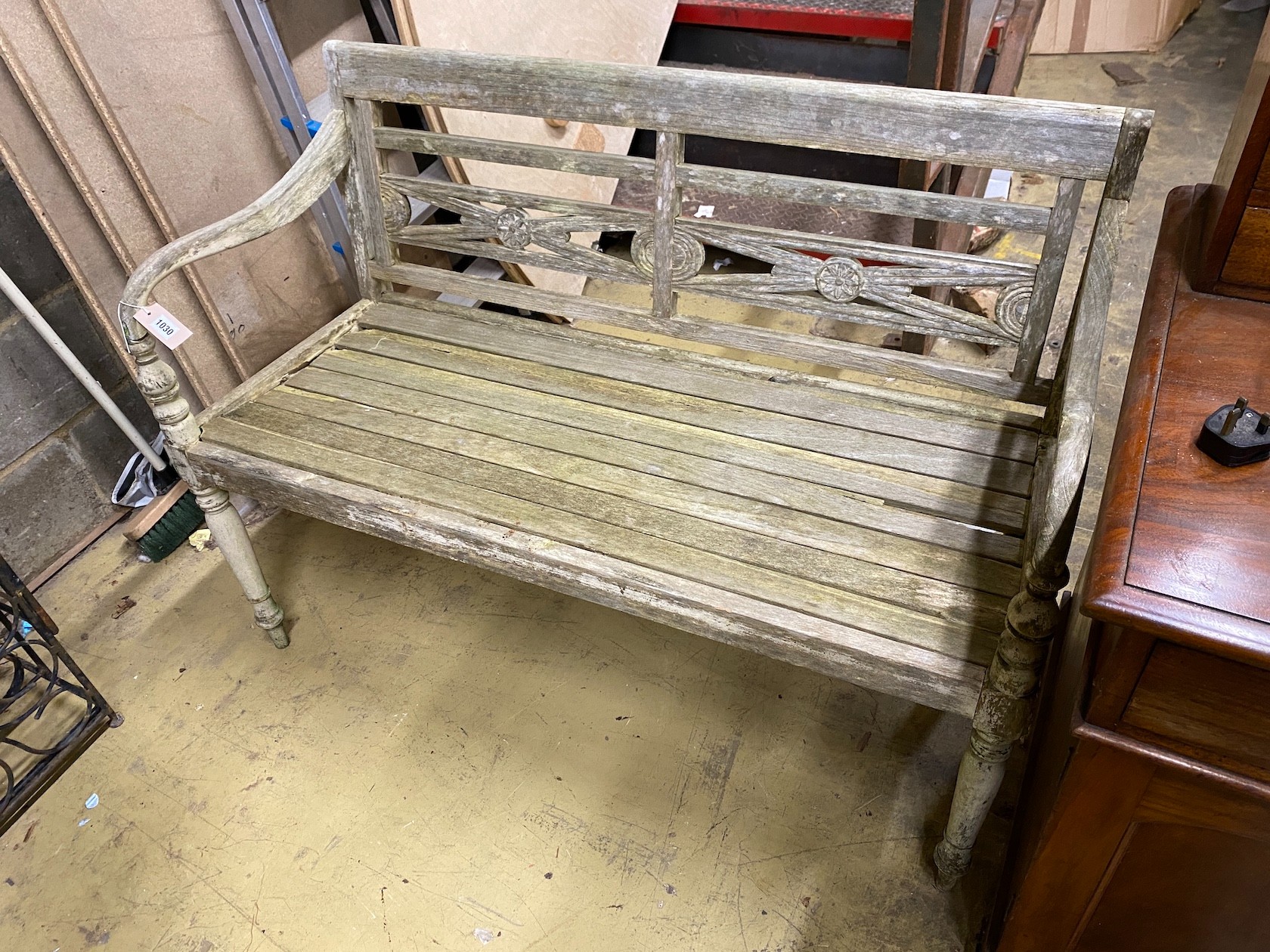 A weathered hardwood garden bench, length 115cm, depth 49cm, height 85cm